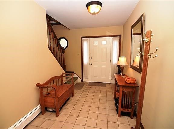 Entry hall has ample room to kick off your shoes: enter from the street or from your attached garages. There is a  coat closet too!