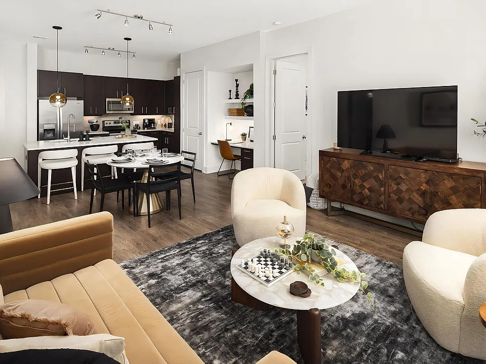 Open Living Room and Kitchen Area With Dining and Workspace Setup
