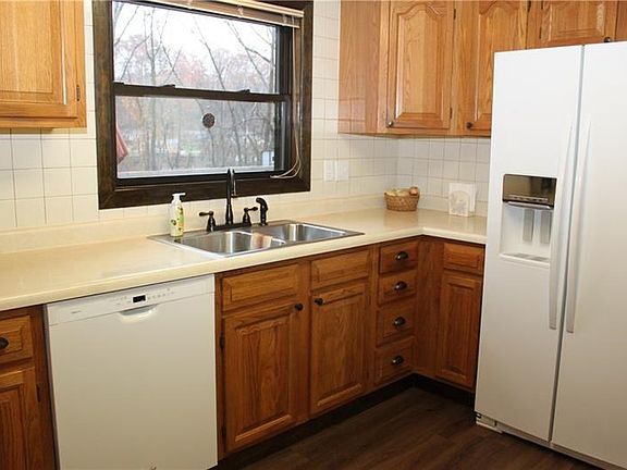 Nice sized fully equipped, updated, clean kitchen with new flooring faucet and all new hardware