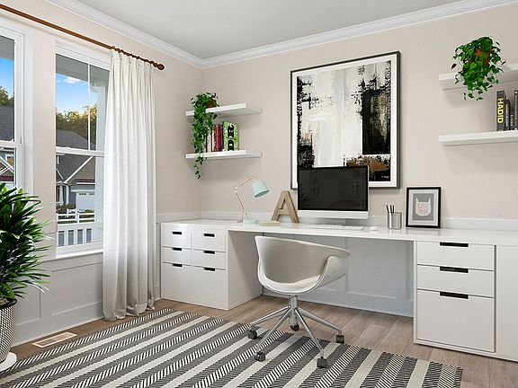 Private office with large double window in a DRB Homes Latitude home.