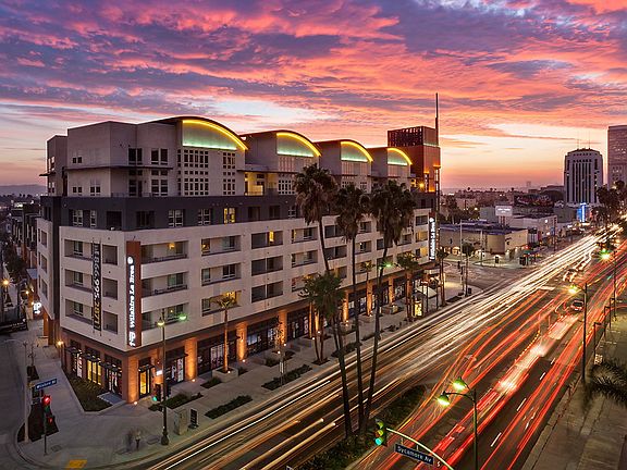 Aerial view of Wilshire La Brea Apartments at sunset.