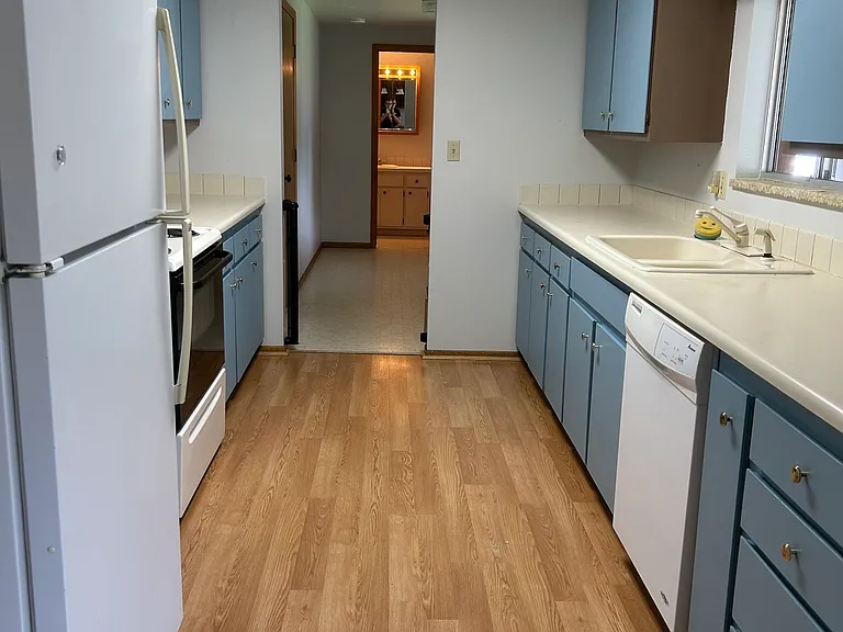 more of this large galley kitchen looking all the way to the 1/2 bath