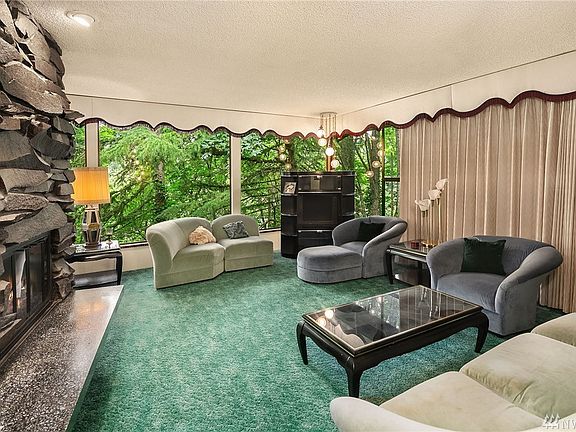 Main level living room with territorial view and beautiful custom double sided fireplace