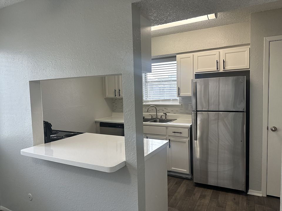 Chef Kitchen Open to Dining Area and Living Room