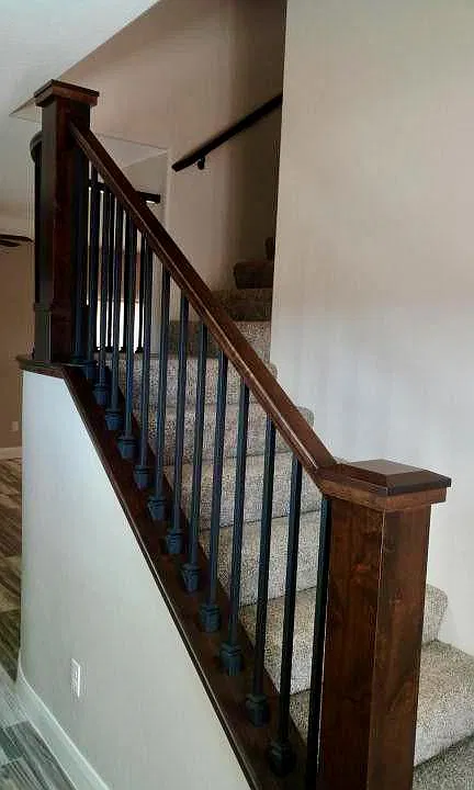 A carpeted staircase leads to the private areas upstairs.