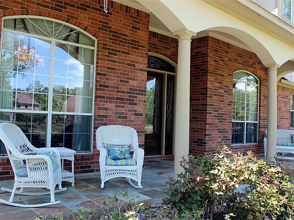 The lovely front porch welcomes all visitors and allows for an immediate feeling of relaxation.