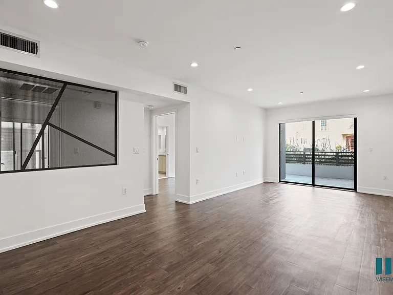 Open-Concept Dining and Living Room Areas with Patio