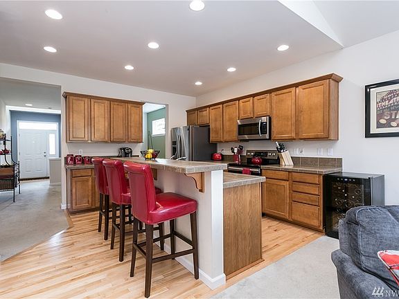Under cabinet lighting and lots of counter space highlight this kitchen. Pantry on the left!