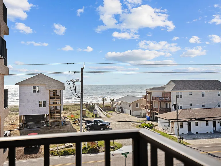 Water view! Surfers often surf at this access. We love people watching and searching for dolphins!