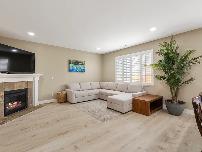 gas fireplace, seating area w/ 65" Smart TV