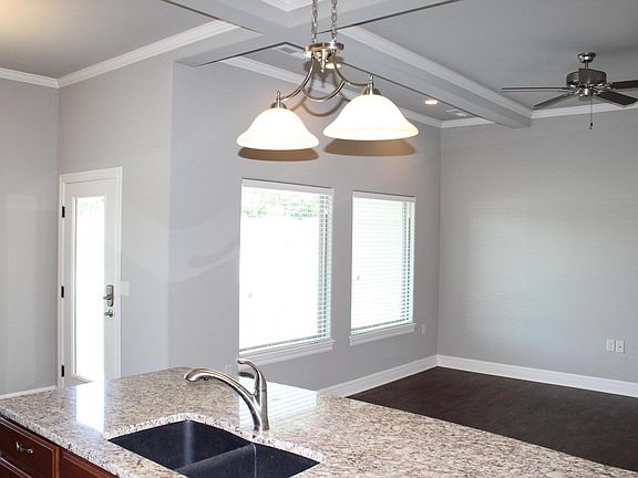 Great room with covered patio in back.