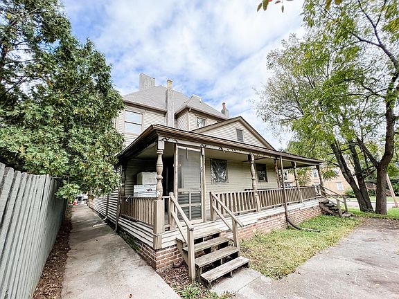 back of house. apartment has private half of porch