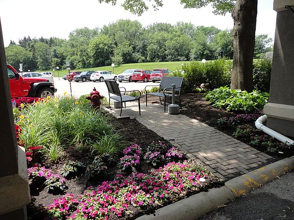 LOVELY SITTING AREA BEFORE ENTERING THE GORGEOUS LOBBY WITH A 24 HOUR DOORMAN
