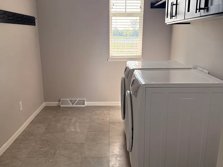 Generous sized laundry room with new washer and dryer for your use included!