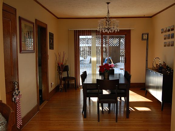 Dining room with sliding glass door to deck and backyard