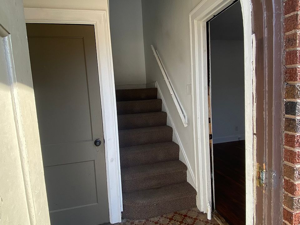 Front door to building, apartment door immediately to the right.