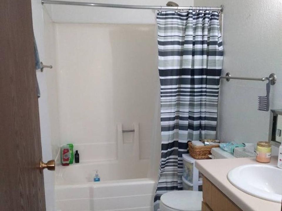 Large, tiled, full bath with tub/shower, fan and LOTS of storage or lines/towels and bath products!