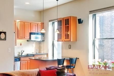 Open Kitchen w/ hidden washer/dryer