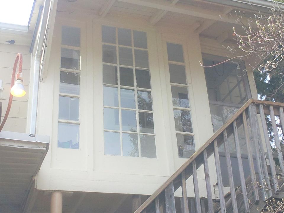 Private entry in the back of duplex includes an enclosed sun porch
