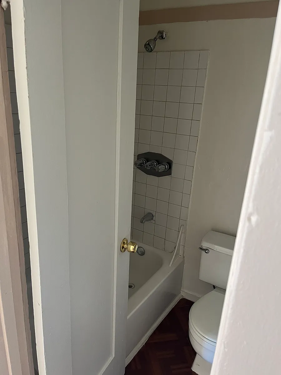 Bathroom with tub to the right of entering the unit - 320 Maine Ave #7