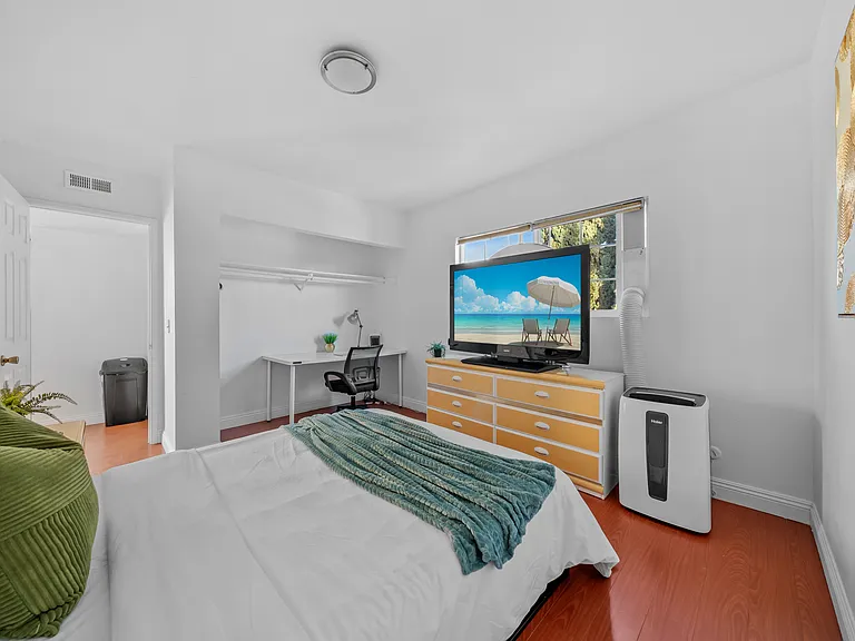 A peaceful bedroom with a workspace_where comfort meets productivity.
