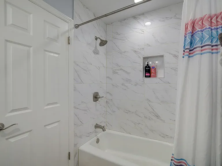 Second full bathroom located at the top of the stairs - with bathtub