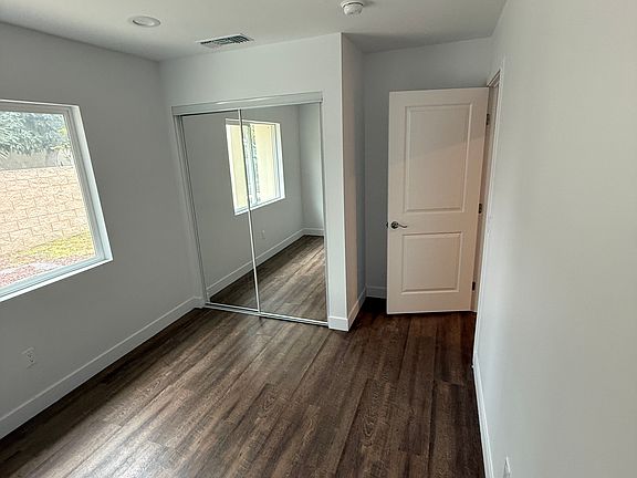 Bedroom 1 with natural light smoke detectors and Central HVAC