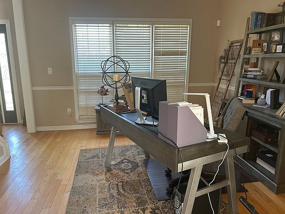 A light-filled first-floor office that flows beautifully into the living room_perfect for work-from-home living!