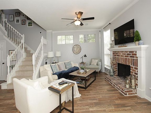 The brick fireplace is perfect for cozy gatherings...