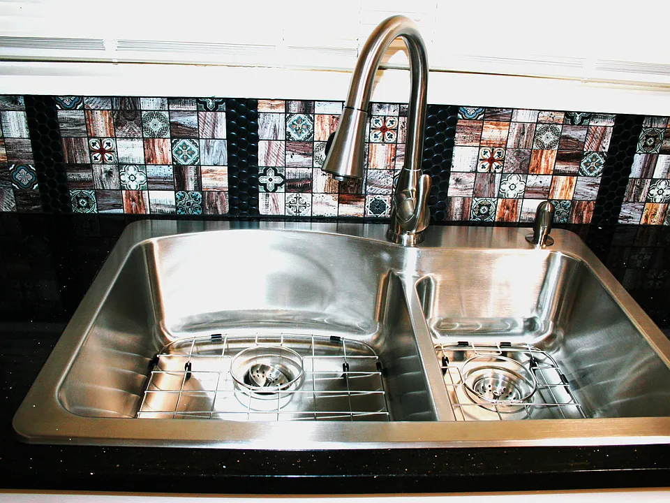 Newer kitchen sink, faucet and back splash