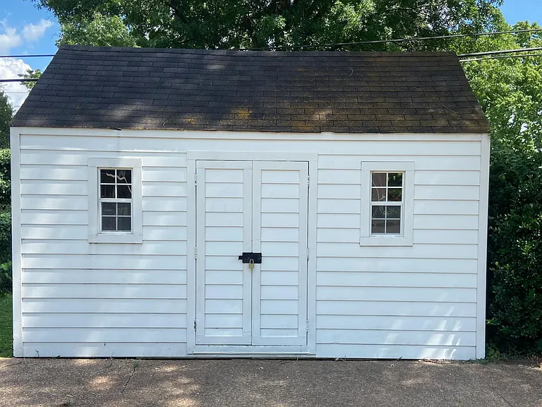 10' x 14' storage shed with lock and overhead additional storage.