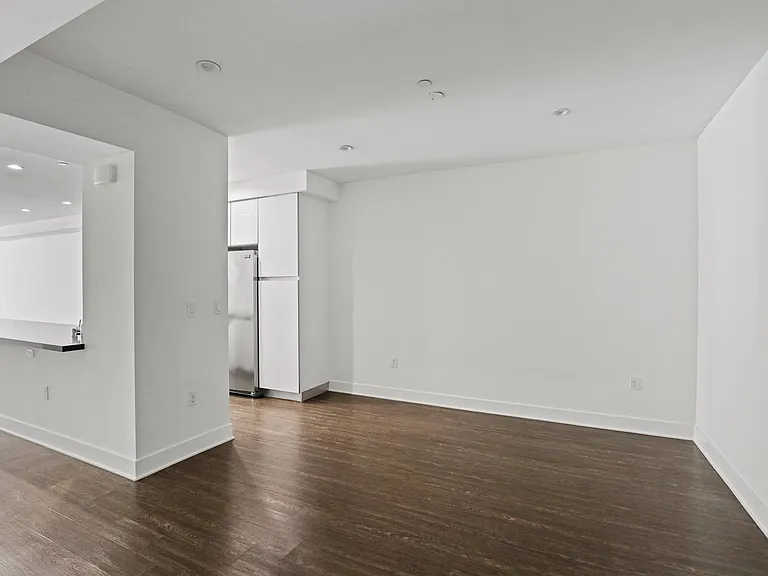 Dining Space with High Ceilings and Vinyl Flooring