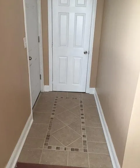 Hallway to closet by front door.