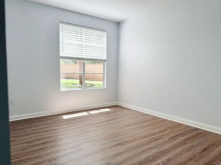 Master bedroom with mature trees and greenbelt views