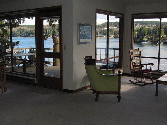 Living room on right and dining area to the left. Ludlow Bay provides the backdrop!