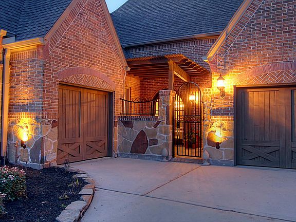 Enter through the iron gate into the covered private courtyard.