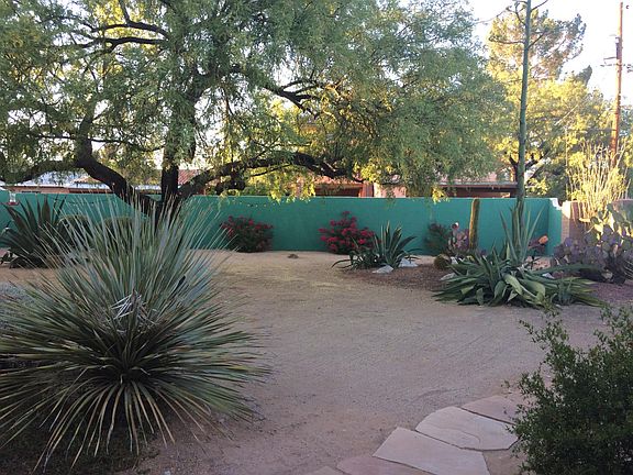 6'+ high surrounding walled yard