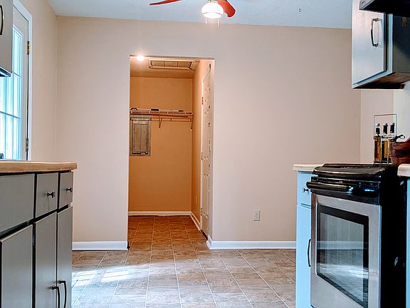 Kitchen area looking at oven from pantry location.