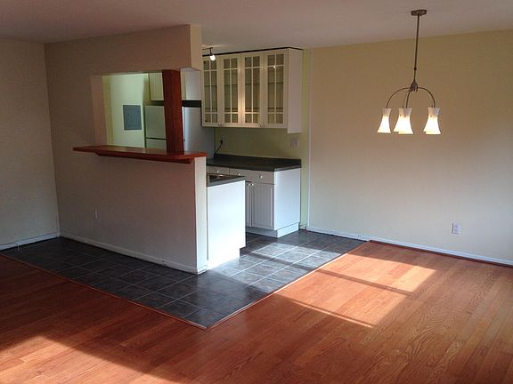 Open space concept kitchen with bar and space for stools, gas stove, oven, fridge and freezer