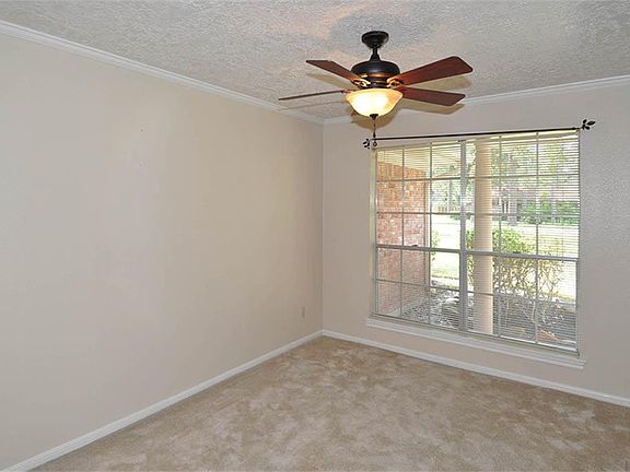 Front windows in living room overlooking the front yard.