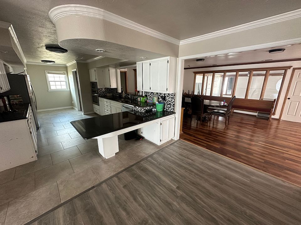 Huge kitchen and dining room with plenty of cabinet space.