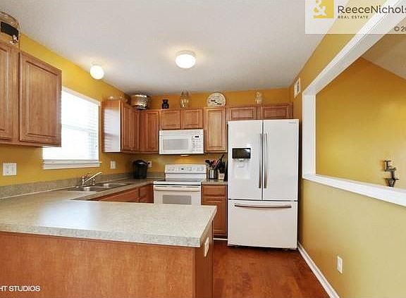Kitchen overlooks family room to keep the chef in the action with family and guests.  The window at the sink will allow the dishwasher or cook to keep an eye on the backyard action.