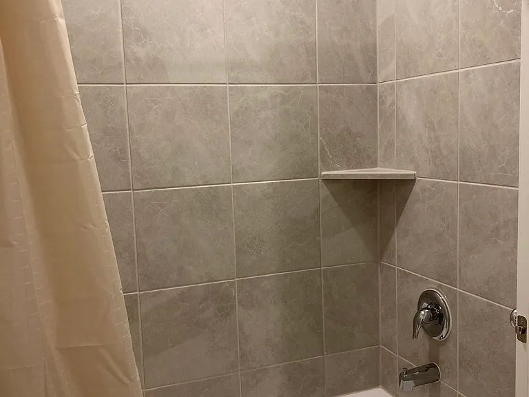 Shower and bath across hall.