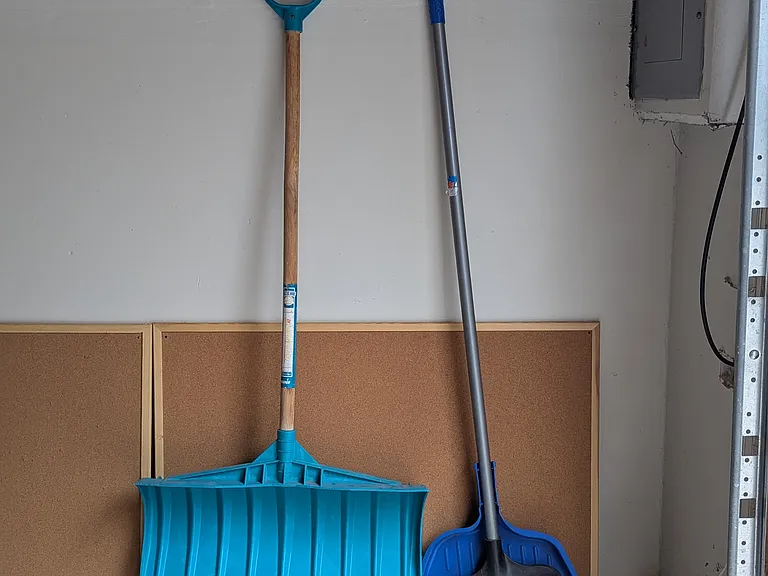 Electrical panel broom and snow shovel in Garage