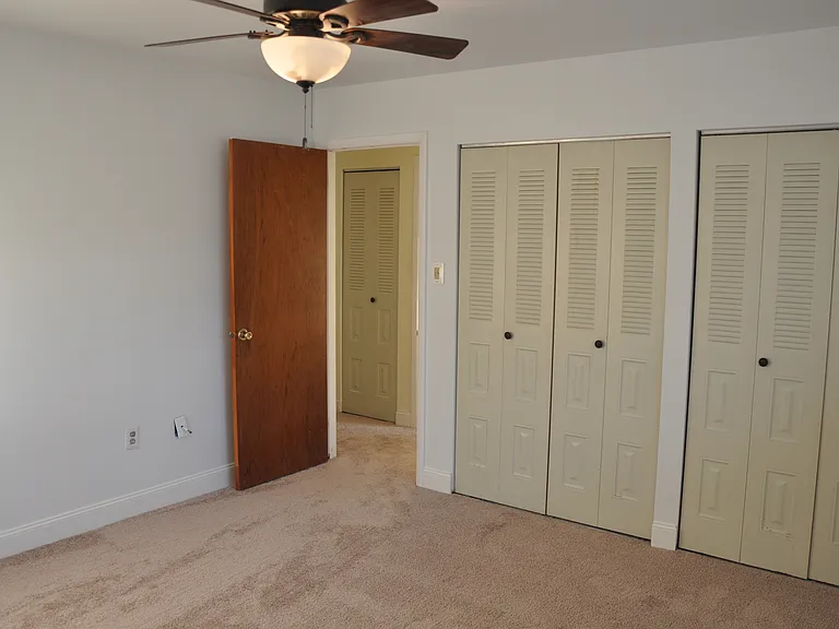 Master bedroom has his and hers double closets, ceiling fan, new carpet and a full master bathroom.