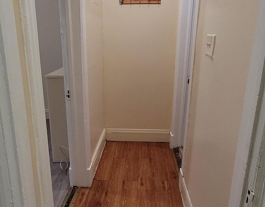 Hallway between bedroom and bathroom