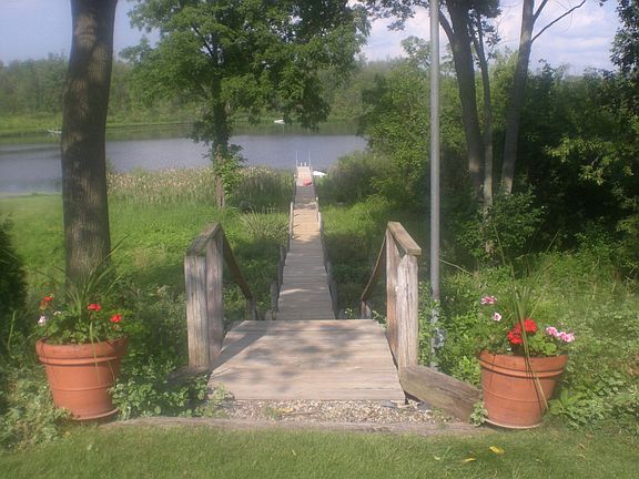 Private walkway and deck leading to 72 feet of lake frontage