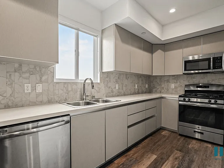 Kitchen with Energy-Efficient Appliances, Vinyl Flooring, and Recessed Lighting