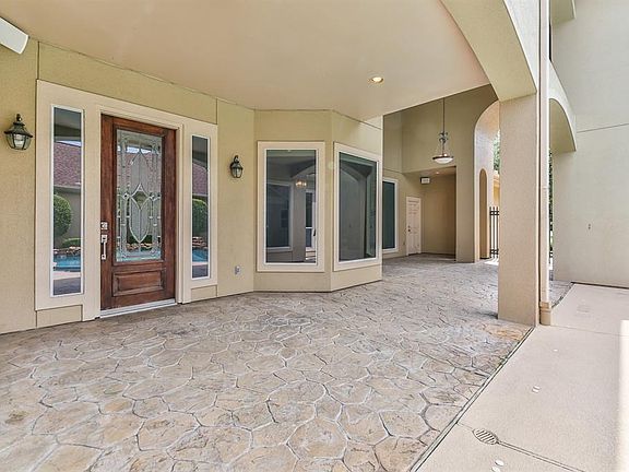 The entrance to the home is covered and gated for privacy.