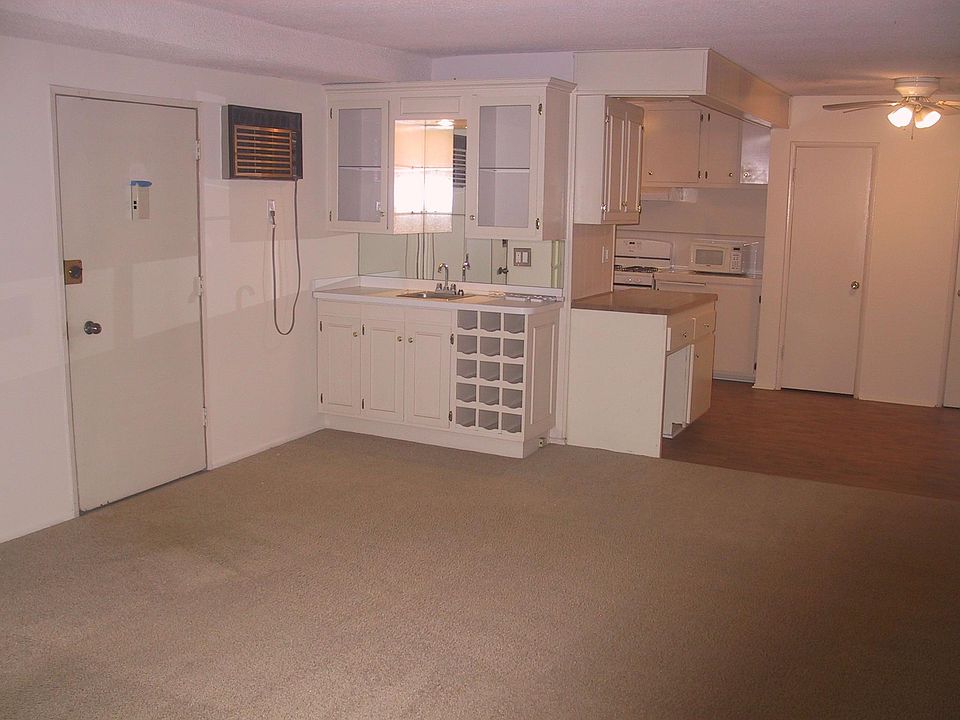 Entry with view of living room and dining area.